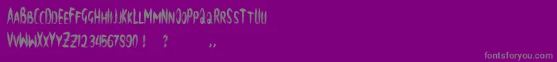 brush-fontti – harmaat kirjasimet violetilla taustalla