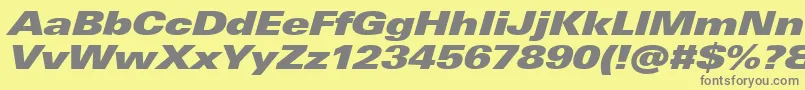UniversNextProExtrablackExtendedItalic-Schriftart – Graue Schriften auf gelbem Hintergrund