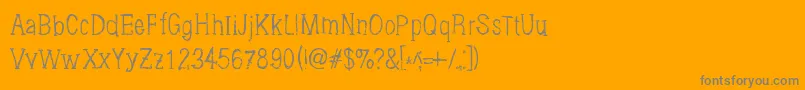 Brushings-fontti – harmaat kirjasimet oranssilla taustalla