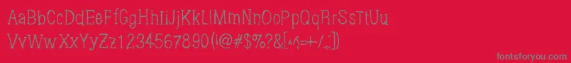 Brushings-fontti – harmaat kirjasimet punaisella taustalla