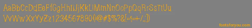 フォントBrushings – オレンジの文字は灰色の背景にあります。
