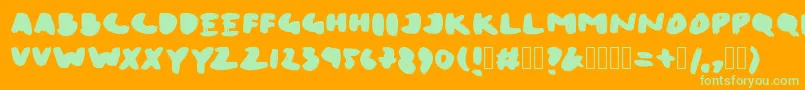 BrushPenXL-Schriftart – Grüne Schriften auf orangefarbenem Hintergrund