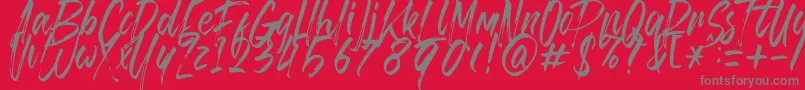 Fonte Brusthy – fontes cinzas em um fundo vermelho