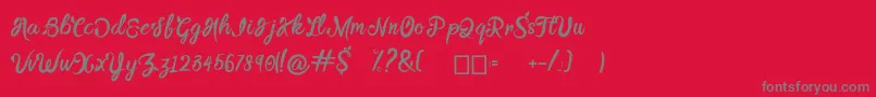 BTX DAINTY CREEK-Schriftart – Graue Schriften auf rotem Hintergrund