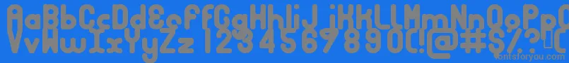 BUBBCB  -fontti – harmaat kirjasimet sinisellä taustalla