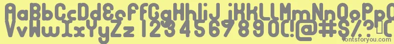 BUBBCB  -fontti – harmaat kirjasimet keltaisella taustalla