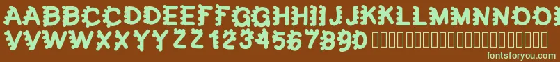 フォントbubblefont – 緑色の文字が茶色の背景にあります。