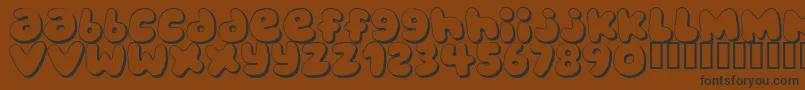 BUBBLEGUMS Font – Black Fonts on Brown Background