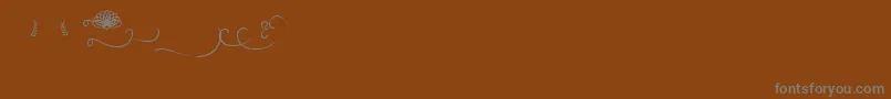 Budapest Swashes Font – Gray Fonts on Brown Background
