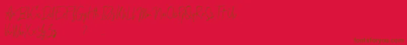 Budaphest Font – Brown Fonts on Red Background