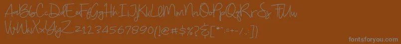 Budayut Font – Gray Fonts on Brown Background