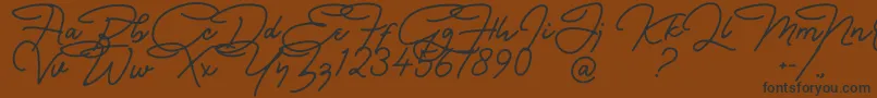 Czcionka Bullstander Free Font – czarne czcionki na brązowym tle