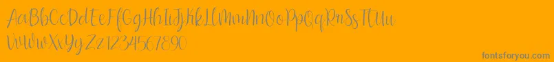 bumble blitz for dafont-Schriftart – Graue Schriften auf orangefarbenem Hintergrund