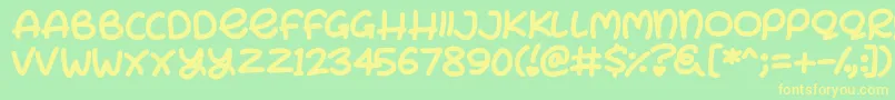 フォントBunny Ears – 黄色の文字が緑の背景にあります