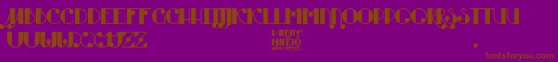 Czcionka Burning Manero – brązowe czcionki na fioletowym tle