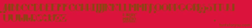フォントBurning Manero – 赤い背景に茶色の文字