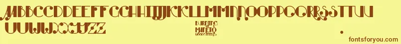 Burning Manero-Schriftart – Braune Schriften auf gelbem Hintergrund