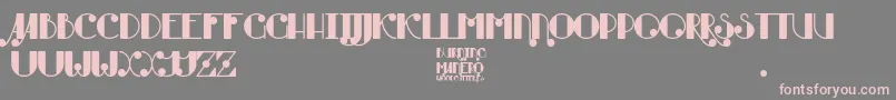 フォントBurning Manero – 灰色の背景にピンクのフォント