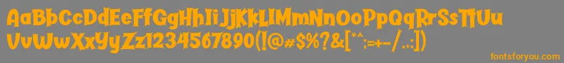 Butter Haunted-Schriftart – Orangefarbene Schriften auf grauem Hintergrund
