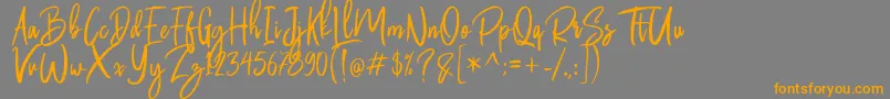 Butter Luchy Free Font – Orange Fonts on Gray Background