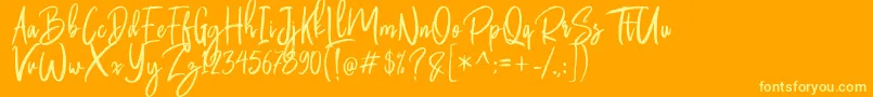 Butter Luchy Free-Schriftart – Gelbe Schriften auf orangefarbenem Hintergrund