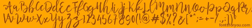 Butter Mellow  -Schriftart – Braune Schriften auf orangefarbenem Hintergrund