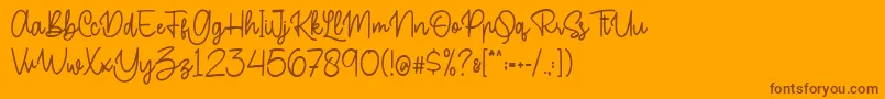 Buttercake Font – Brown Fonts on Orange Background