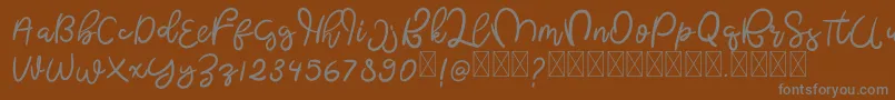 フォントButterflyFree – 茶色の背景に灰色の文字