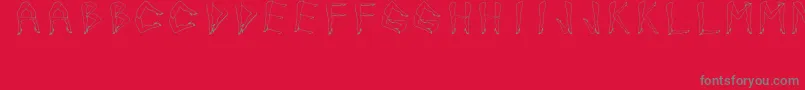 JuanjoSHotLegs-Schriftart – Graue Schriften auf rotem Hintergrund