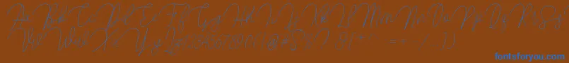 Butty-Schriftart – Blaue Schriften auf braunem Hintergrund