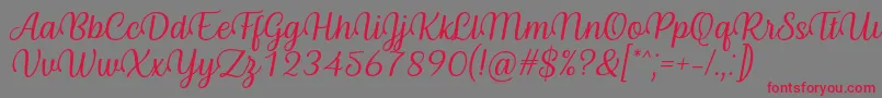 Byby Font Italic-Schriftart – Rote Schriften auf grauem Hintergrund