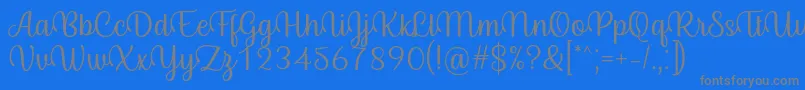 Fonte Byby Font Regular – fontes cinzas em um fundo azul