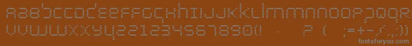Fonte bytepolice – fontes cinzas em um fundo marrom