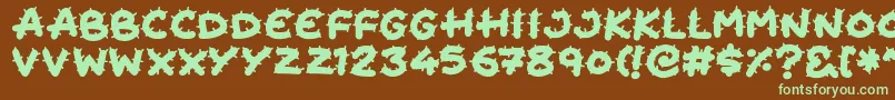 フォントCactus Cuties – 緑色の文字が茶色の背景にあります。