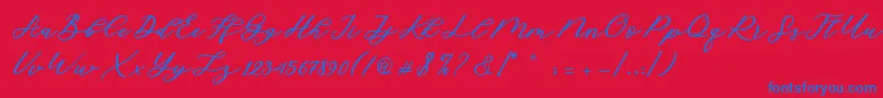 Cadosa Script-Schriftart – Blaue Schriften auf rotem Hintergrund