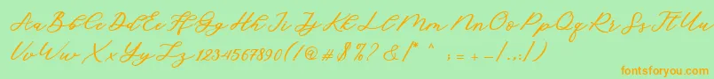 フォントCadosa Script – オレンジの文字が緑の背景にあります。