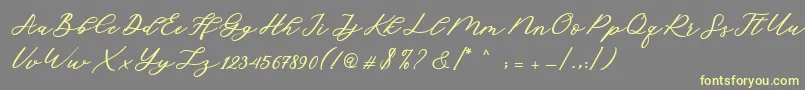 Fonte Cadosa Script – fontes amarelas em um fundo cinza