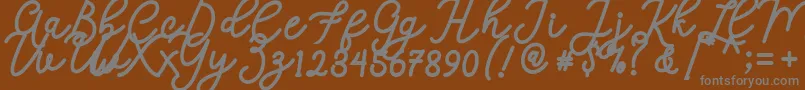 Calega-fontti – harmaat kirjasimet ruskealla taustalla