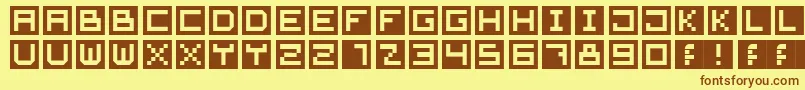 フォントCubeFont – 茶色の文字が黄色の背景にあります。