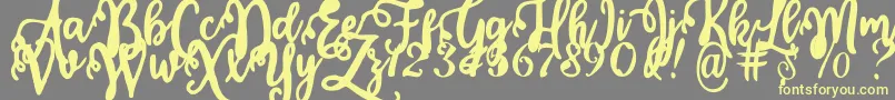Fonte Calligraphy Stye – fontes amarelas em um fundo cinza