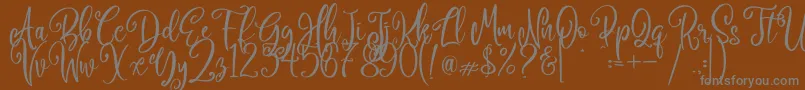 Camellia-Schriftart – Graue Schriften auf braunem Hintergrund