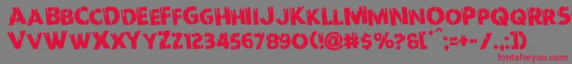 フォントRedundeadrotate – 赤い文字の灰色の背景