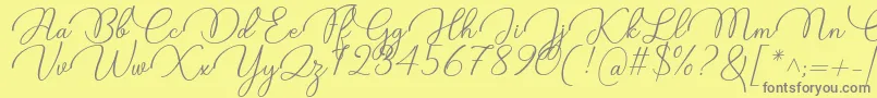 Candire Font by 7NTypes Font – Gray Fonts on Yellow Background