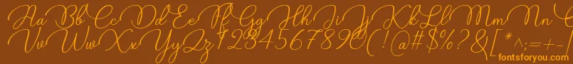 Candire Font by 7NTypes-fontti – oranssit fontit ruskealla taustalla