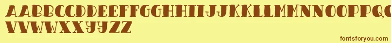 フォントCandy Night Demo – 茶色の文字が黄色の背景にあります。