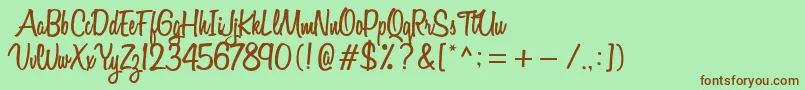 Fonte VarianeScript – fontes marrons em um fundo verde