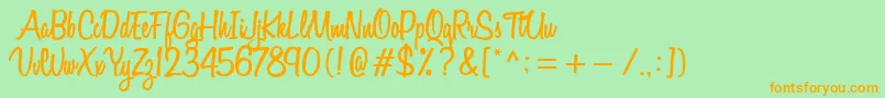 VarianeScript Font – Orange Fonts on Green Background