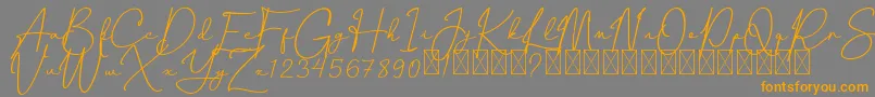 CanthikaFree-fontti – oranssit fontit harmaalla taustalla