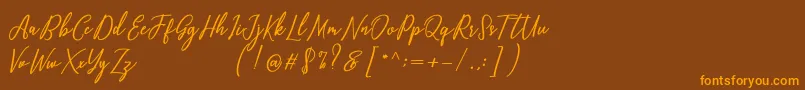 Capital Script Font – Orange Fonts on Brown Background