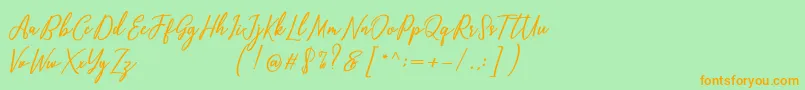 Capital Script Font – Orange Fonts on Green Background